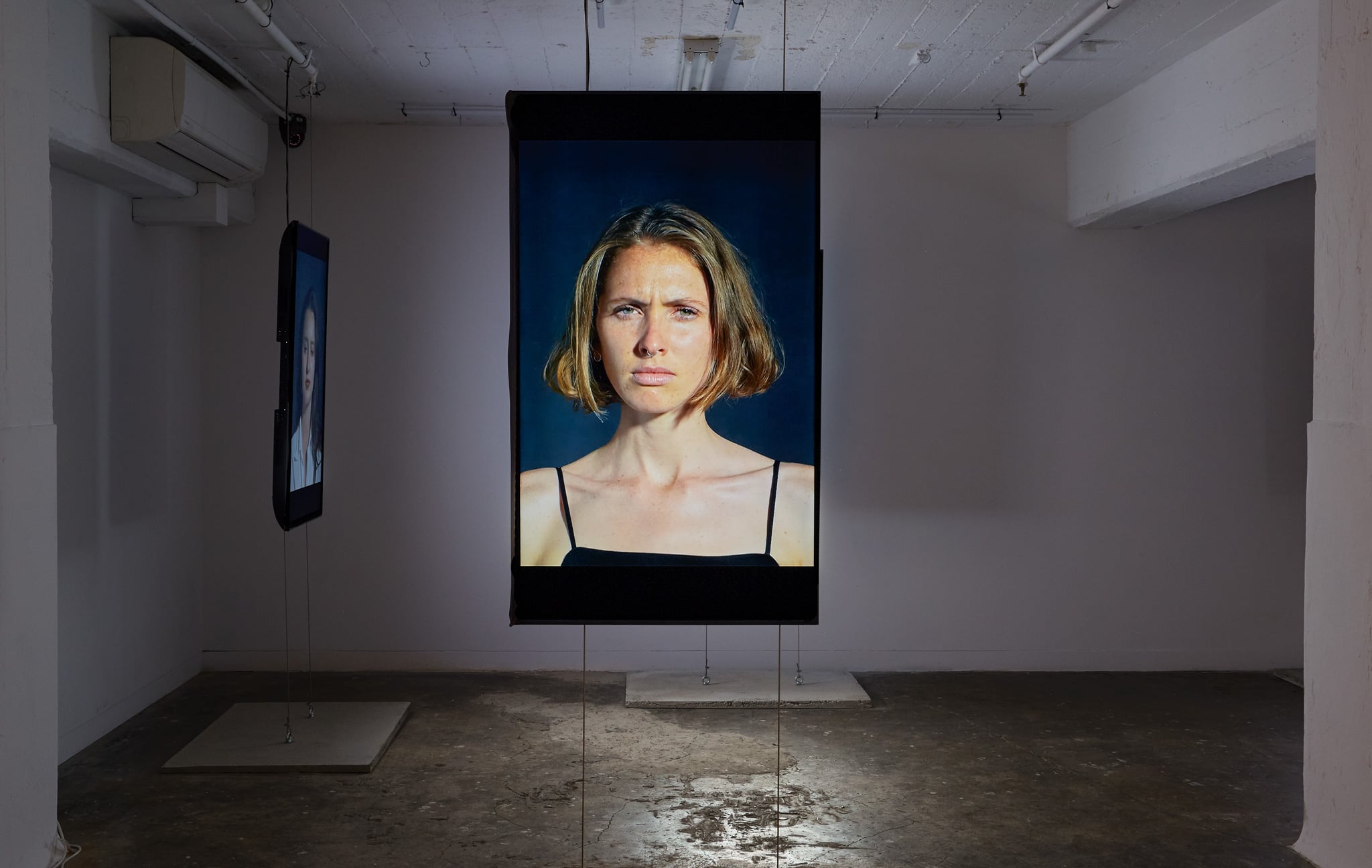 <p><i>Flash Portraits</i>, 2018, 5 channel installation, vertically orientated LCD screens, 1200 x 700mm, Installation View, DownUnder Gallery 2018</p>